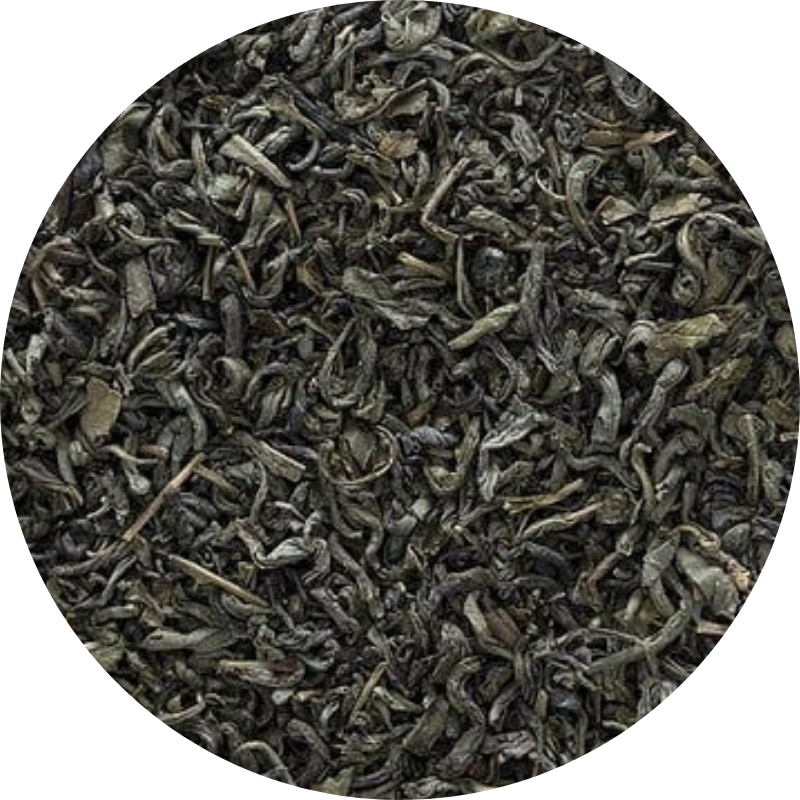 A close-up view of dried green tea leaves.
